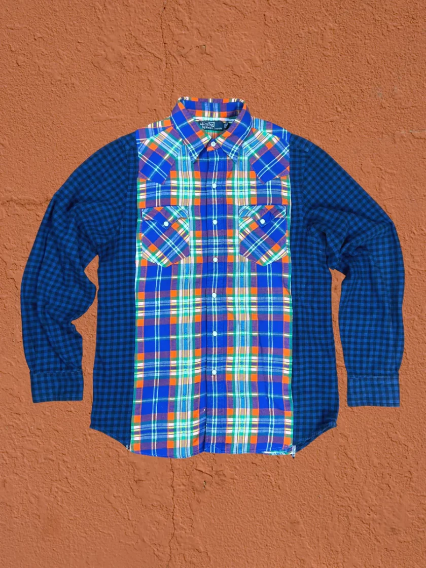 a blue and orange plaid shirt hanging on a wall.