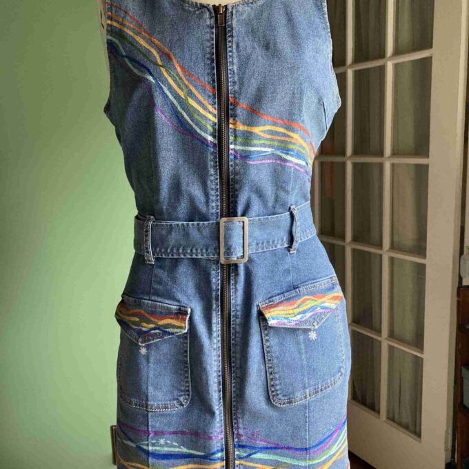 a mannequin wearing a denim dress with a zipper.