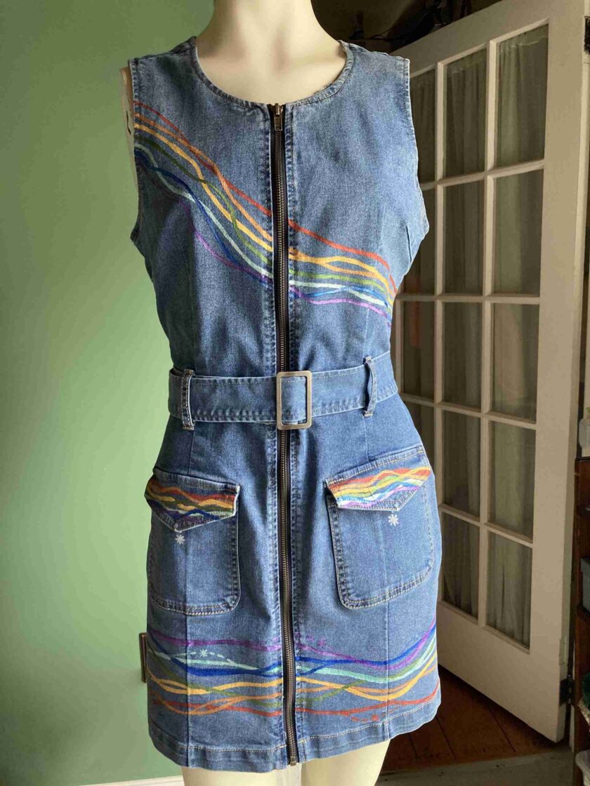 a mannequin wearing a denim dress with a zipper.