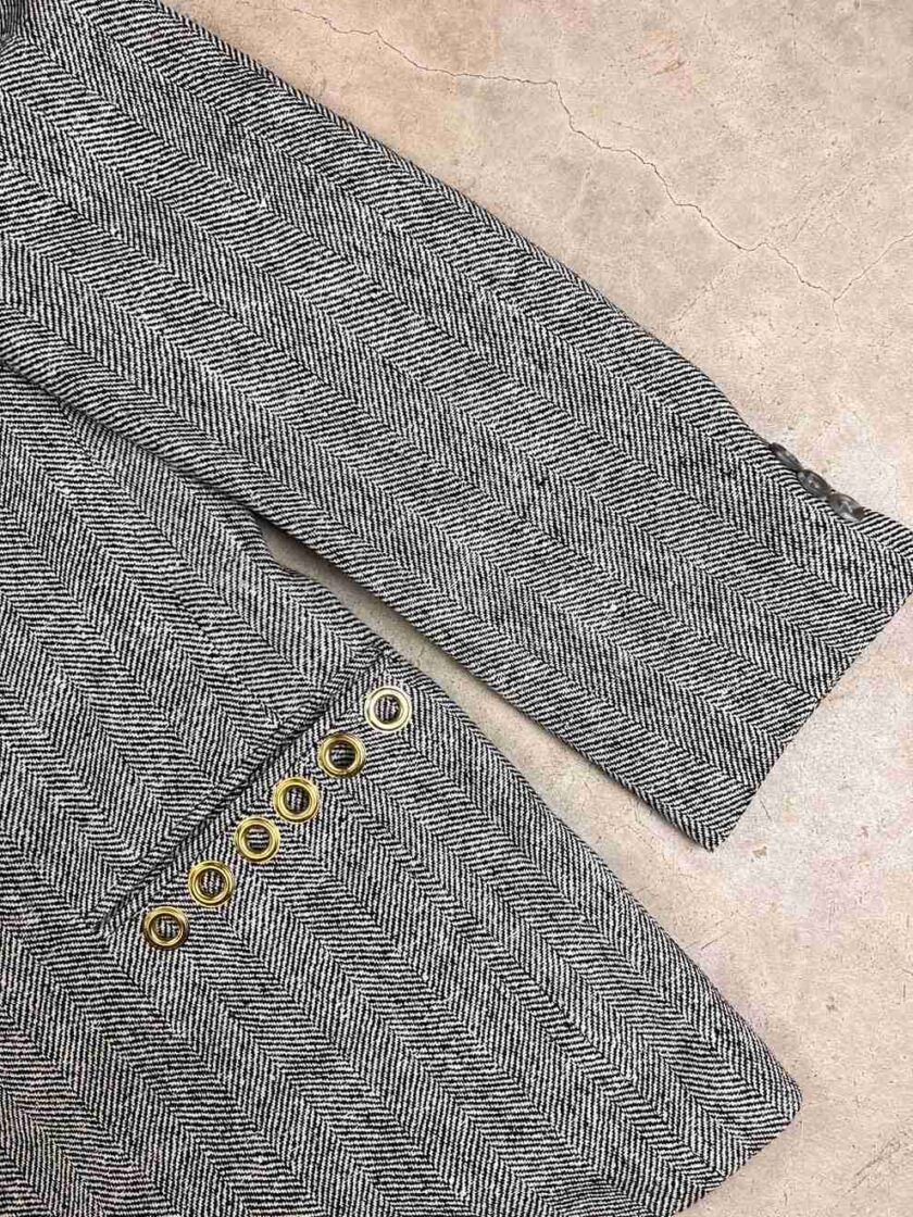 a close up of a jacket with buttons on it.