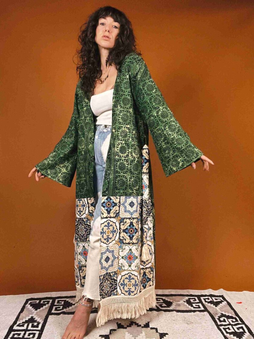 a woman standing on a rug wearing a green jacket.