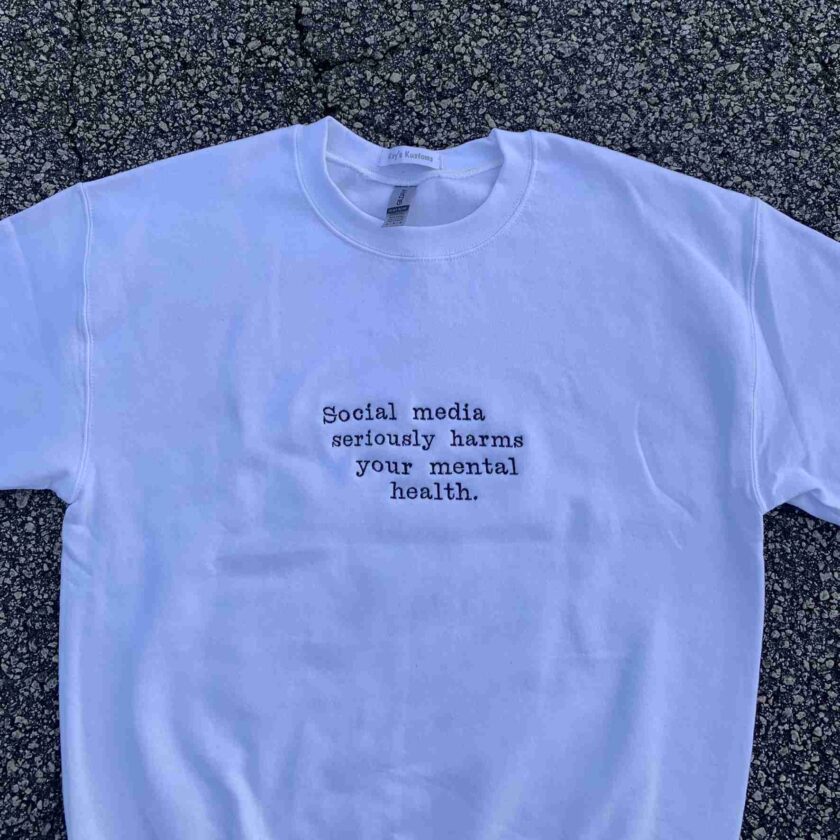a white t - shirt that says social media seriously harms your mental health.