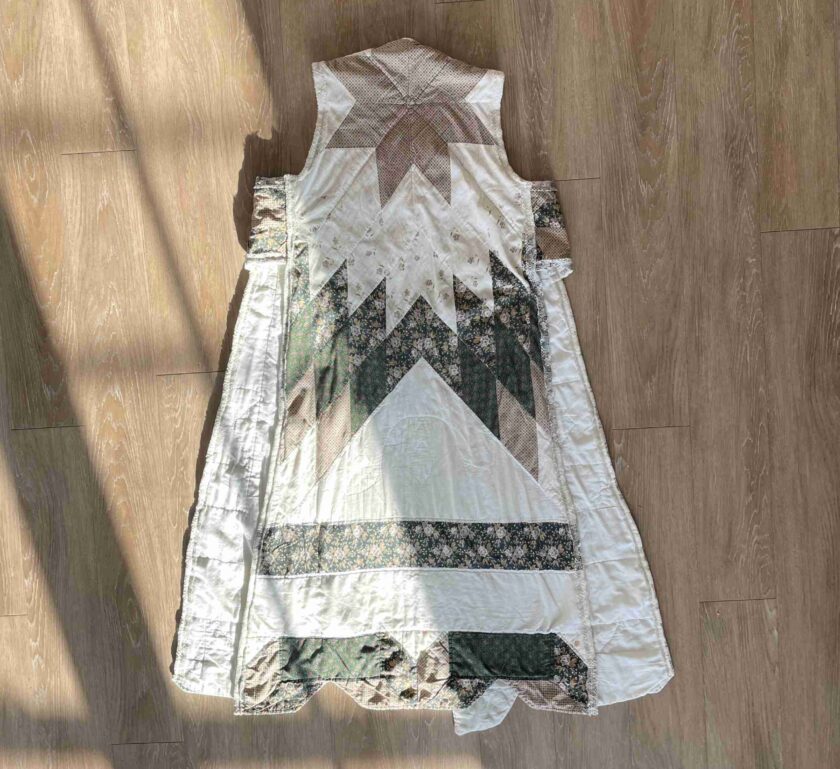 a dress laying on a wooden floor on the floor.