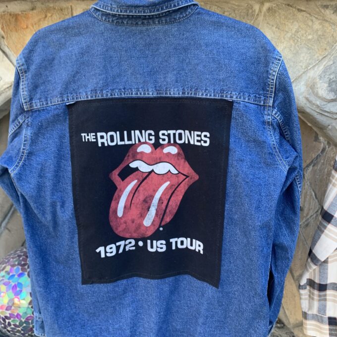 a denim jacket with the rolling stones on it.