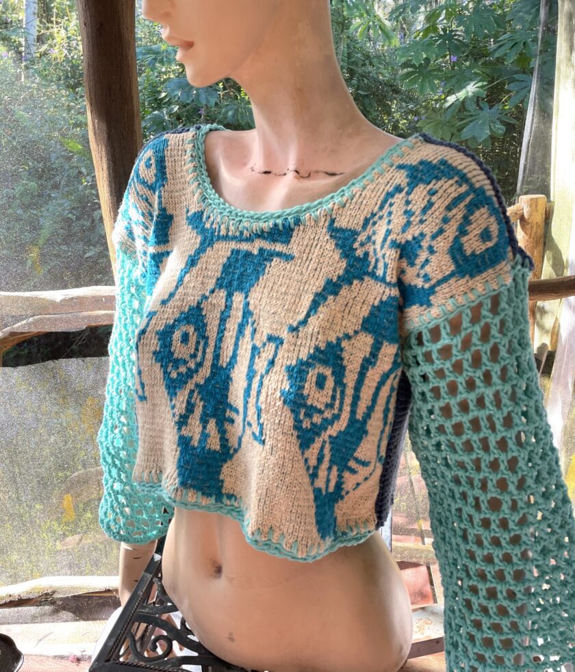 a mannequin wearing a blue and white top.