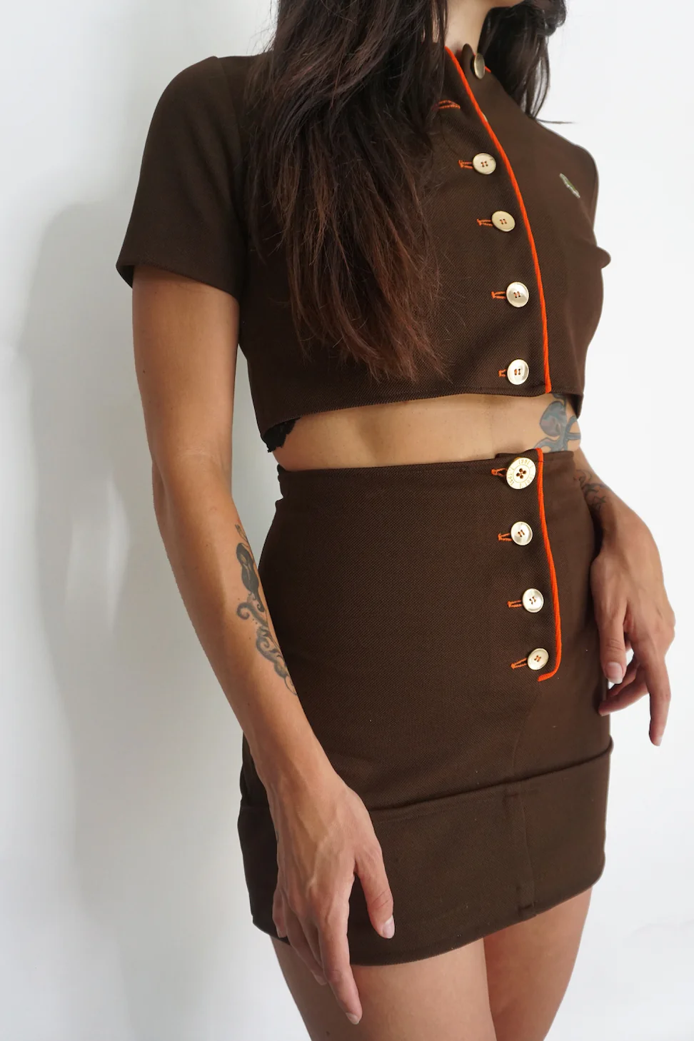 A woman wearing the Vintage 2 Piece Crop Top and Mini Skirt Set.