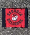 a red and black bandana laying on the ground.