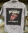 a button up shirt with a picture of the rolling stones on it.