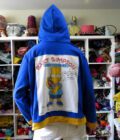 a person standing in front of a Bart Simpson Hoodie (3X-Large).