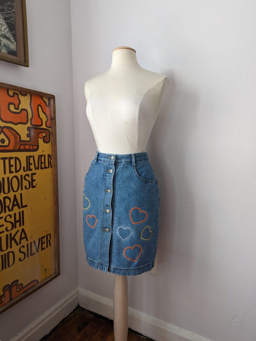 a white mannequin wearing a Reworked Embroidered Heart Skirt.