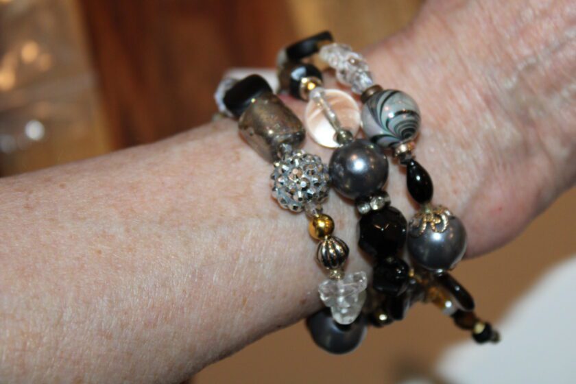 a close up of a person wearing a bracelet.