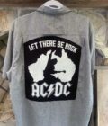 An AC/DC Let There Be Rock gray button up shirt with a black and white design on it.