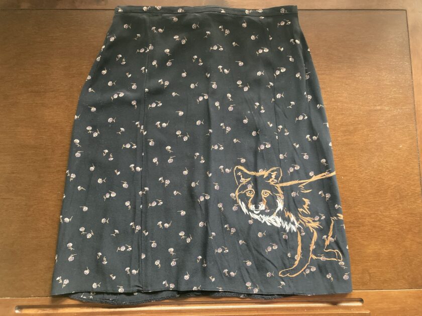 A Floral fox hand-painted vintage skirt with a picture of a dog on it.