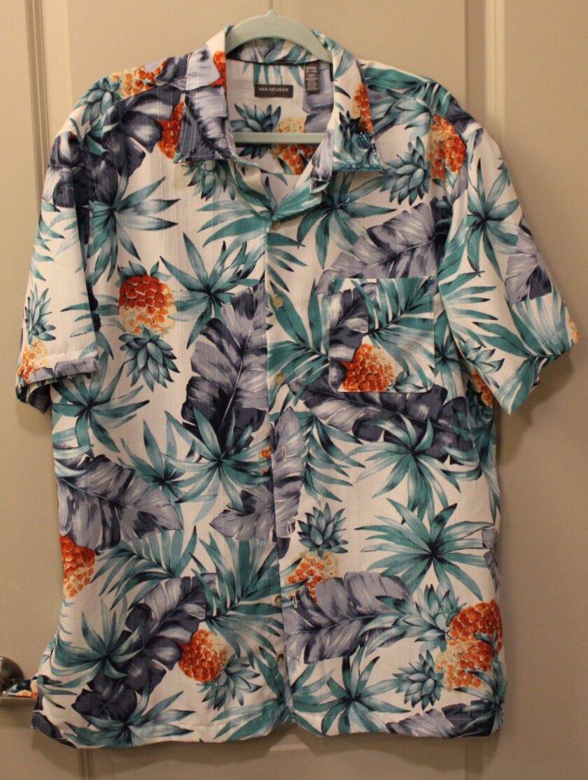 Men's brightly colored Hawaiian Shirt on hanger