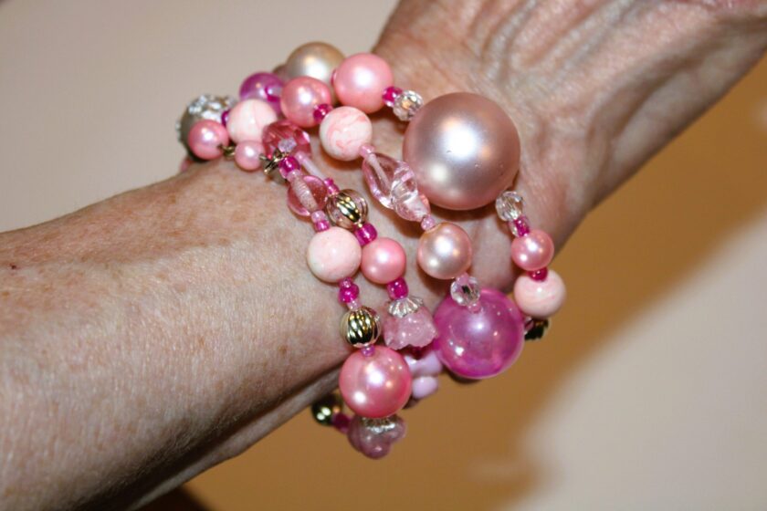 a view of the pink beaded bracelet on the wrist