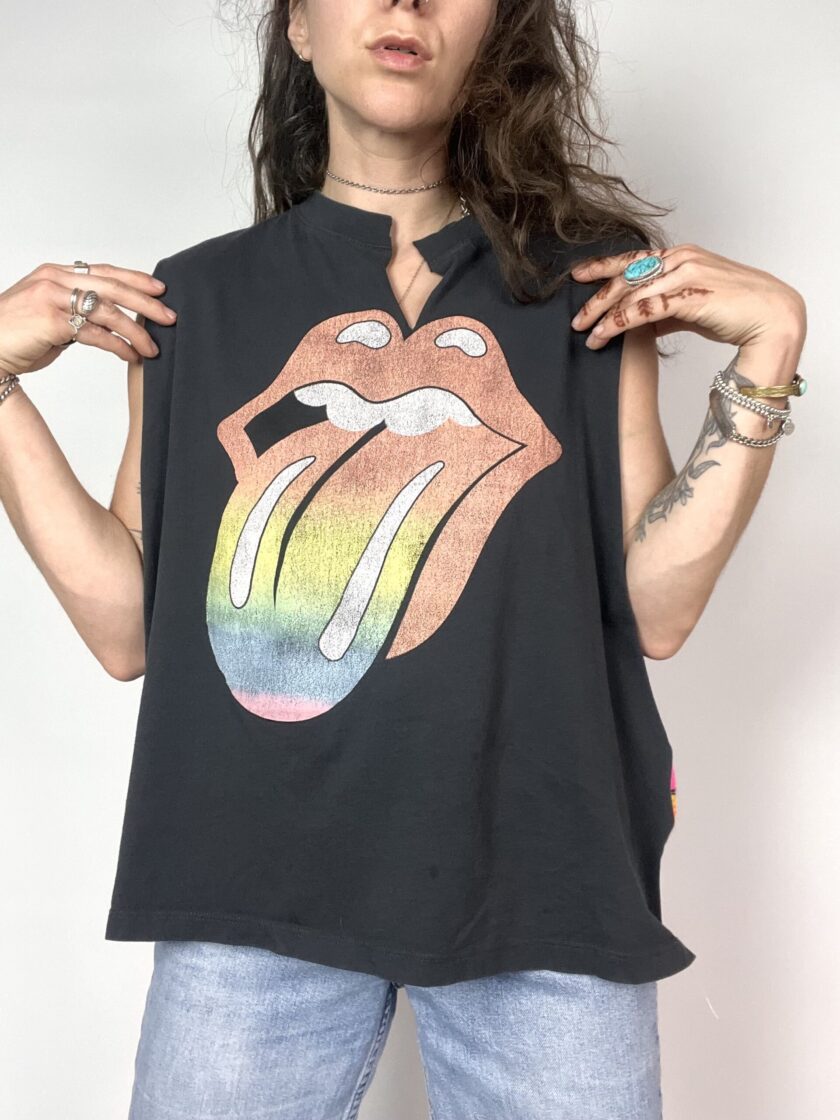 a woman wearing a black shirt with the rolling stones on it.