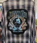 a black and white checkered shirt with a picture of johnny cash on it.