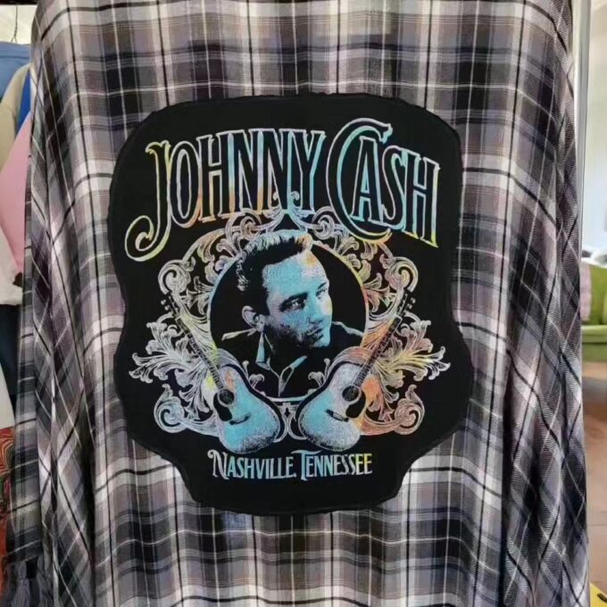 a black and white checkered shirt with a picture of johnny cash on it.