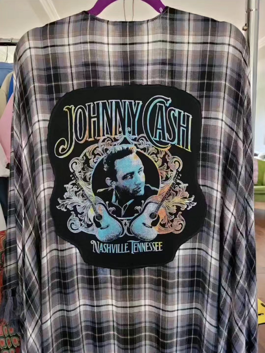 a black and white checkered shirt with a picture of johnny cash on it.