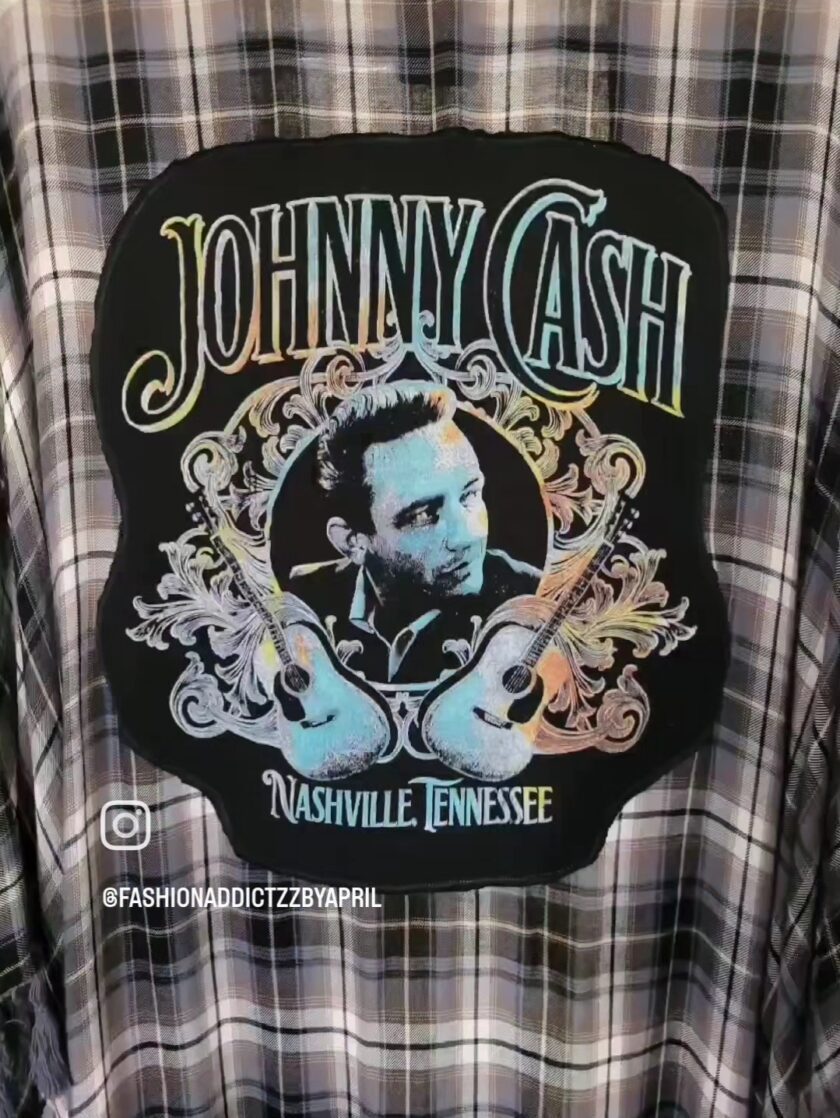 a black and white shirt with a picture of johnny cash on it.