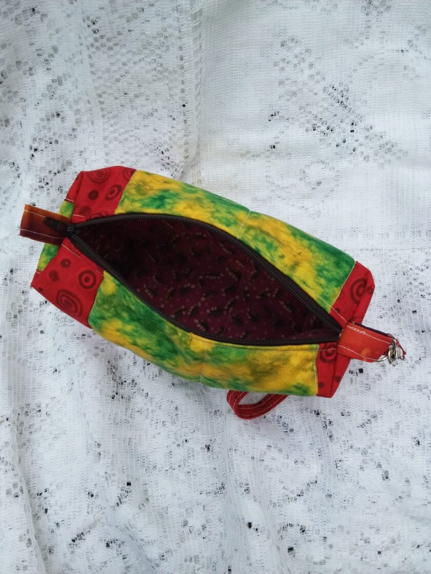Retro Artsy wristlet handbag with key chain strap in bold red and funky batik