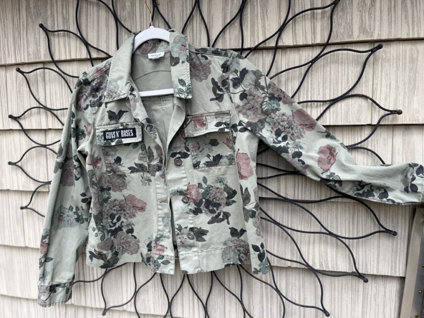 a floral jacket hanging on a wall.