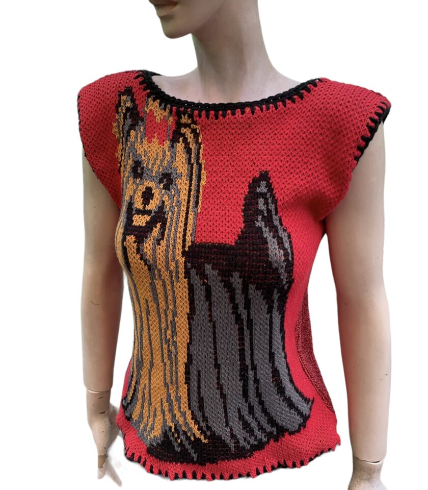 a mannequin wearing a knitted dog sweater.