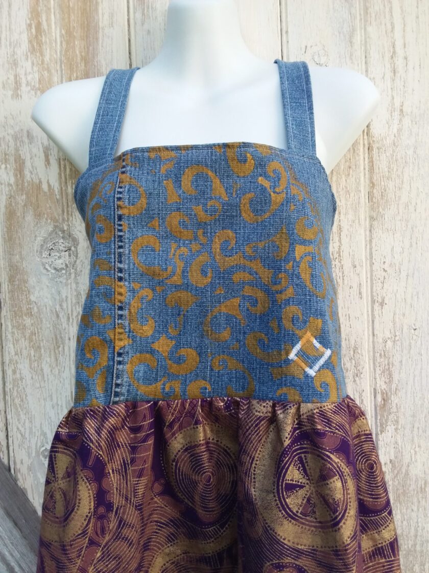 a denim dress with a purple and gold spiral pattern