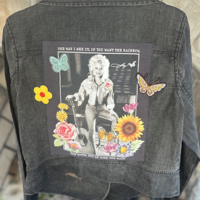 A denim jacket with a picture of dolly parton on it.