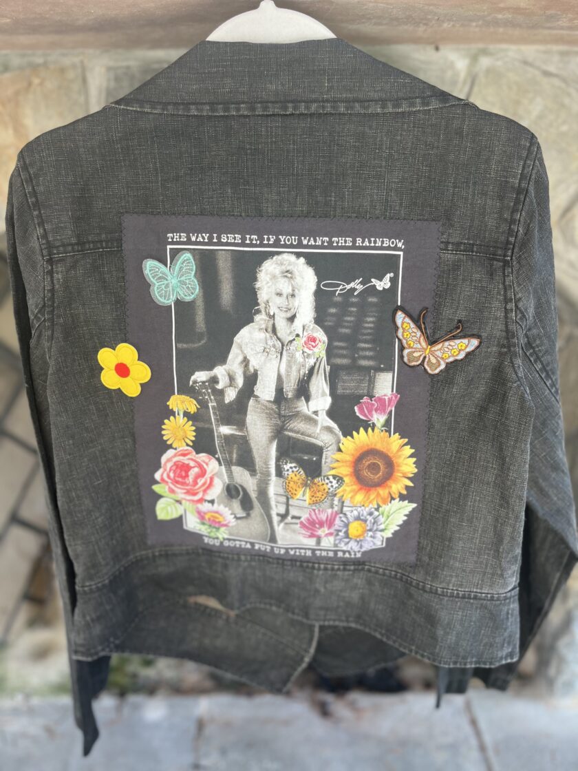 A denim jacket with a picture of dolly parton on it.