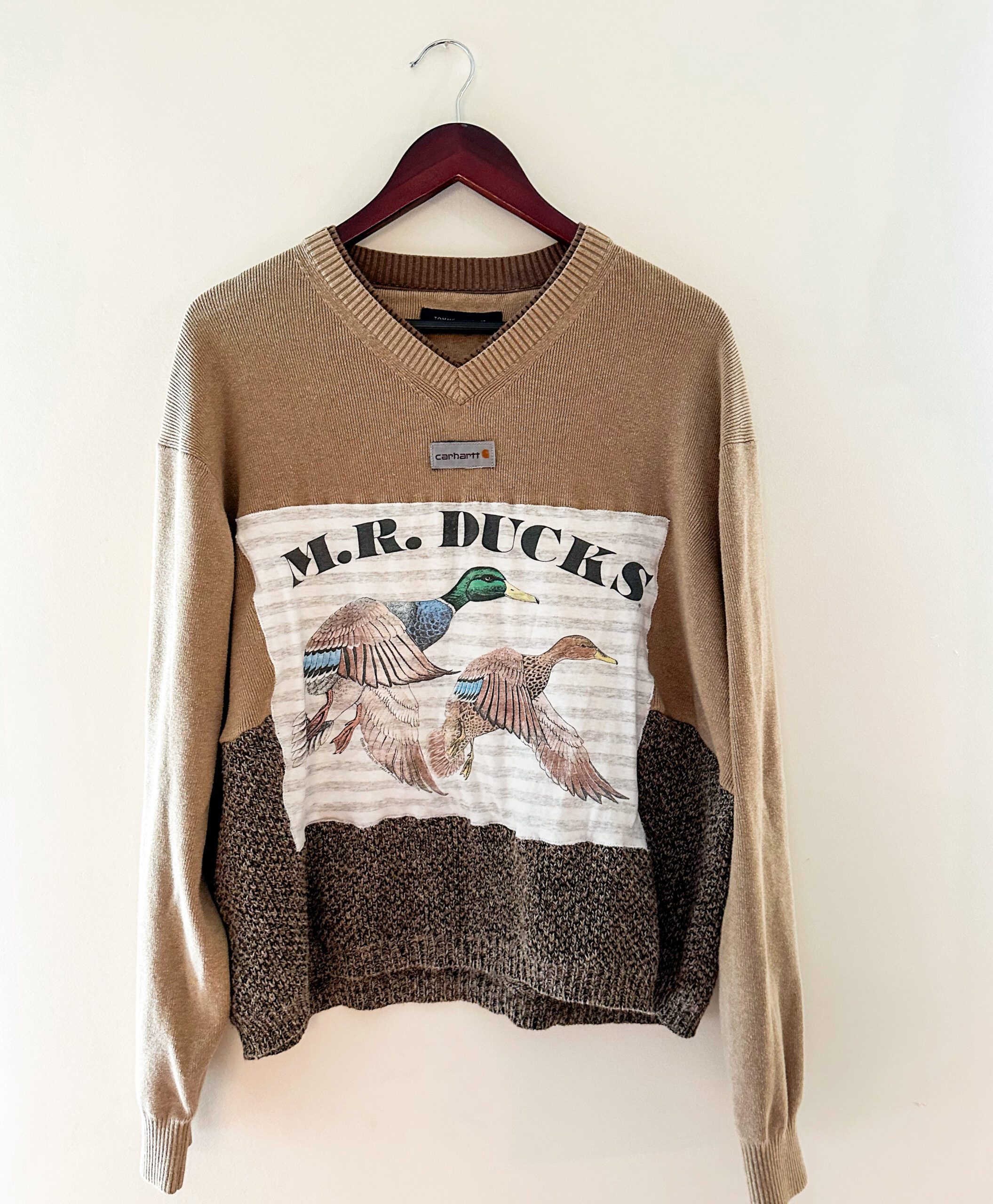 A sweater with the words mr ducks on it.