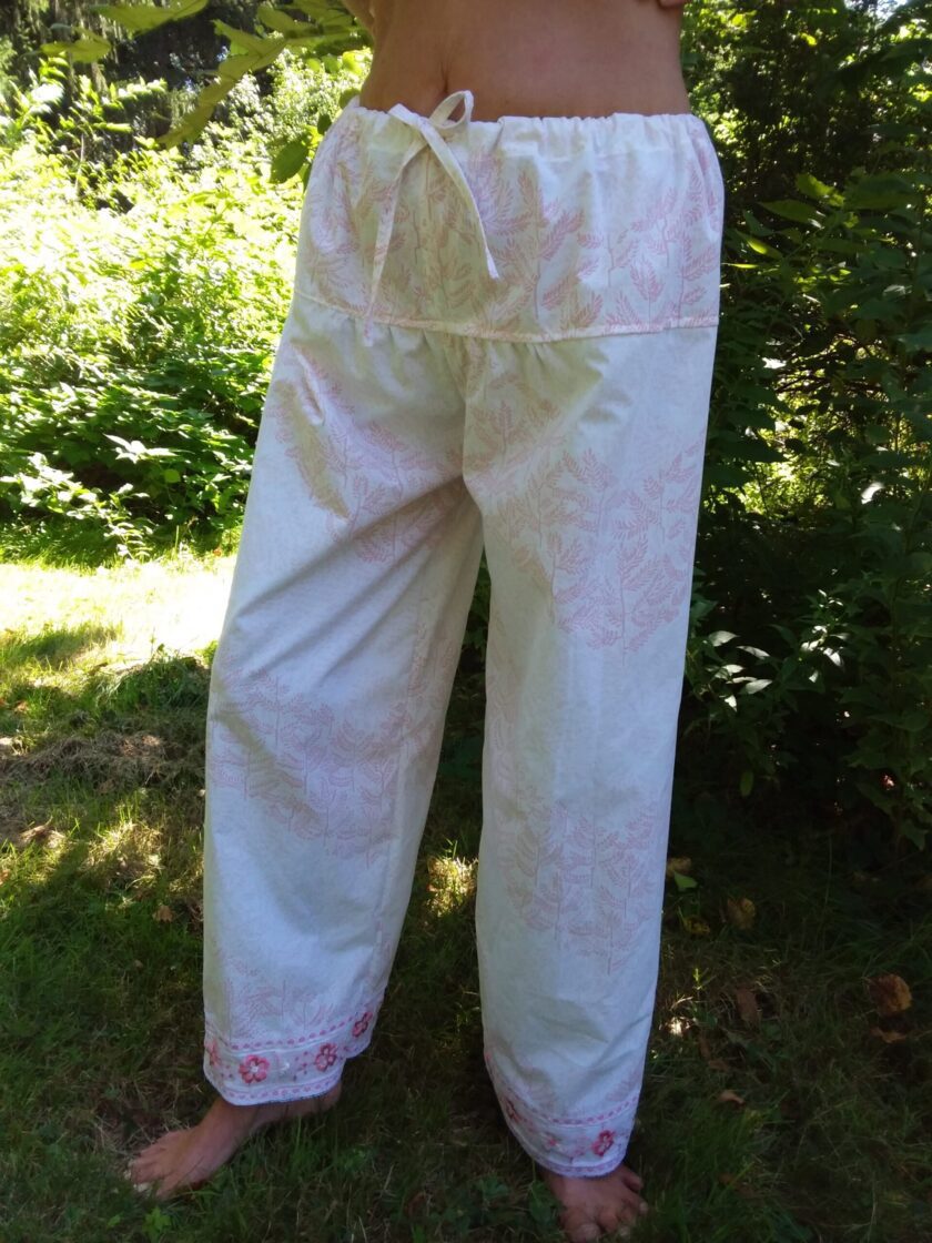 White and pink palazzo pants made from repurposed fabric worn by a model