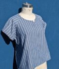 A blue and white striped top on a mannequin.