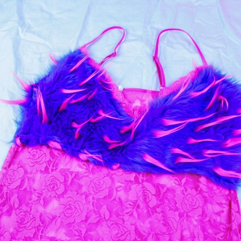 A pink and purple dress with feathers on it.