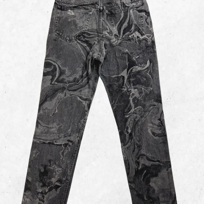 A pair of black and gray pants with a marble pattern.