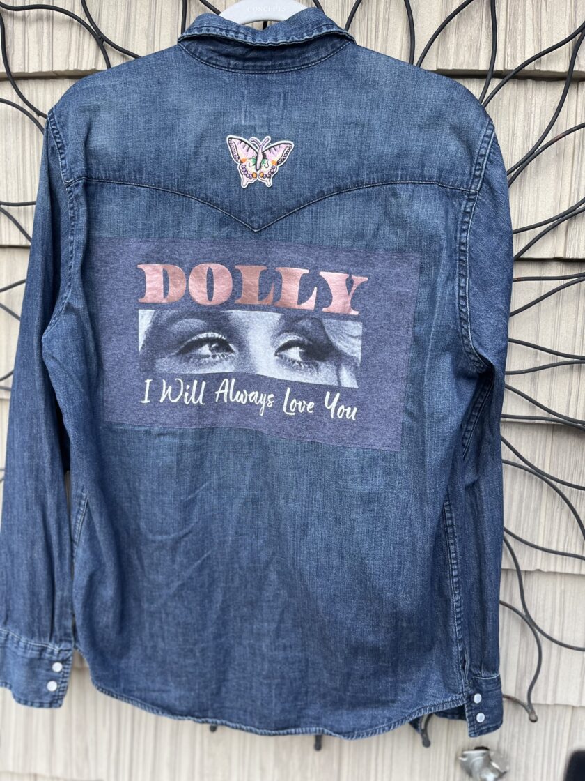 A denim jacket with a picture of a woman on it.