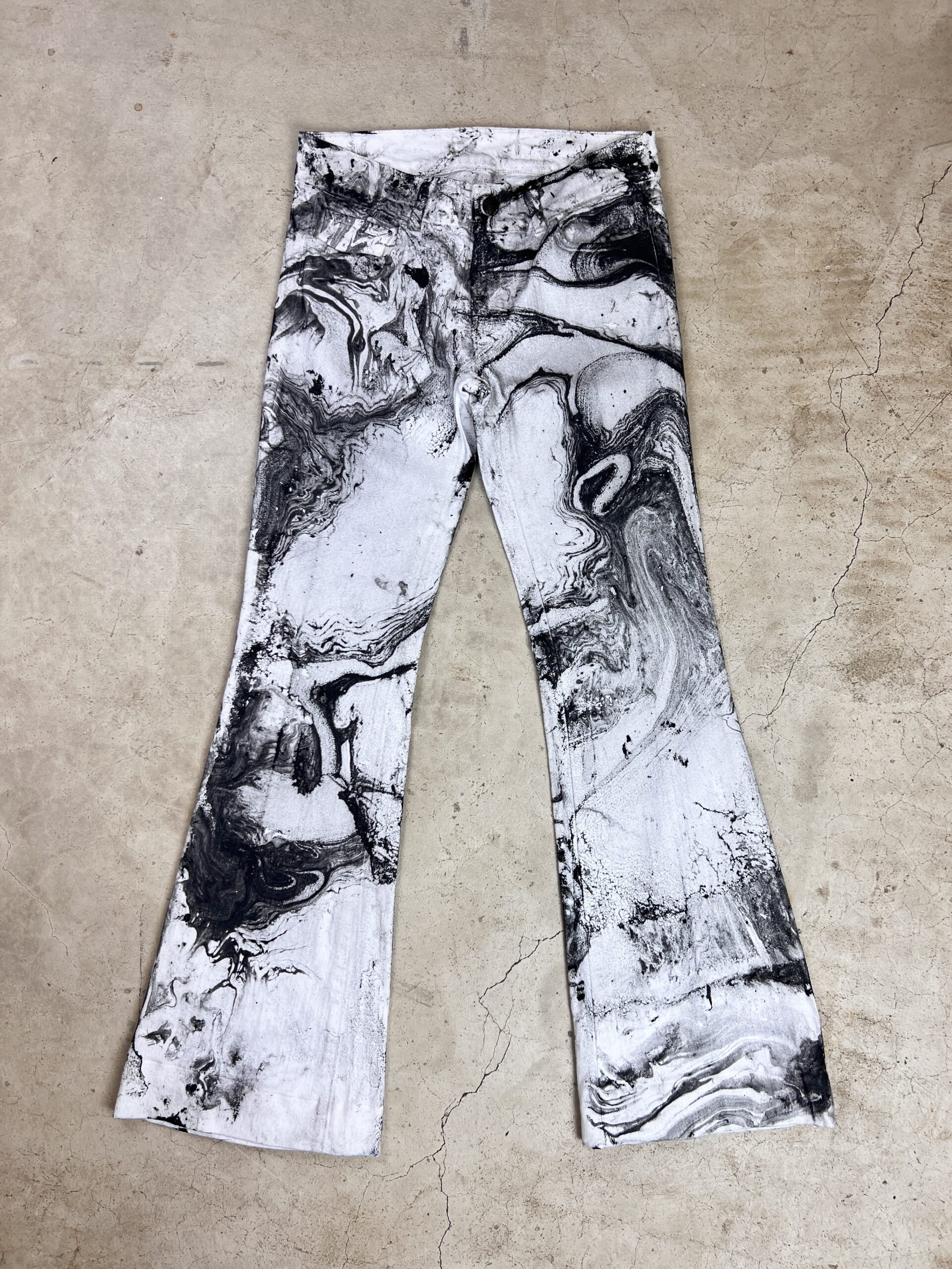 A pair of black and white flared pants.