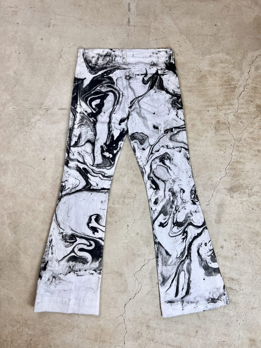 A pair of black and white pants with a black and white print.