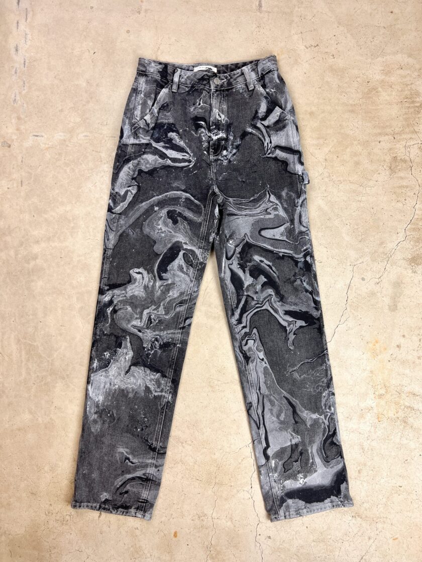 A pair of black and white camouflage pants.