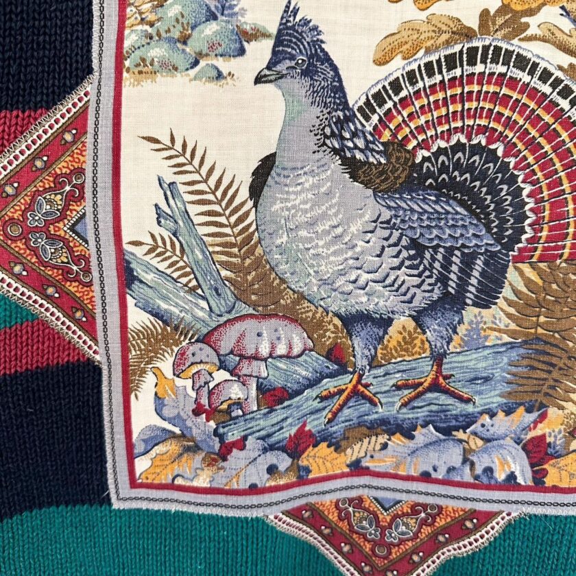 A scarf with an image of a pheasant on it.
