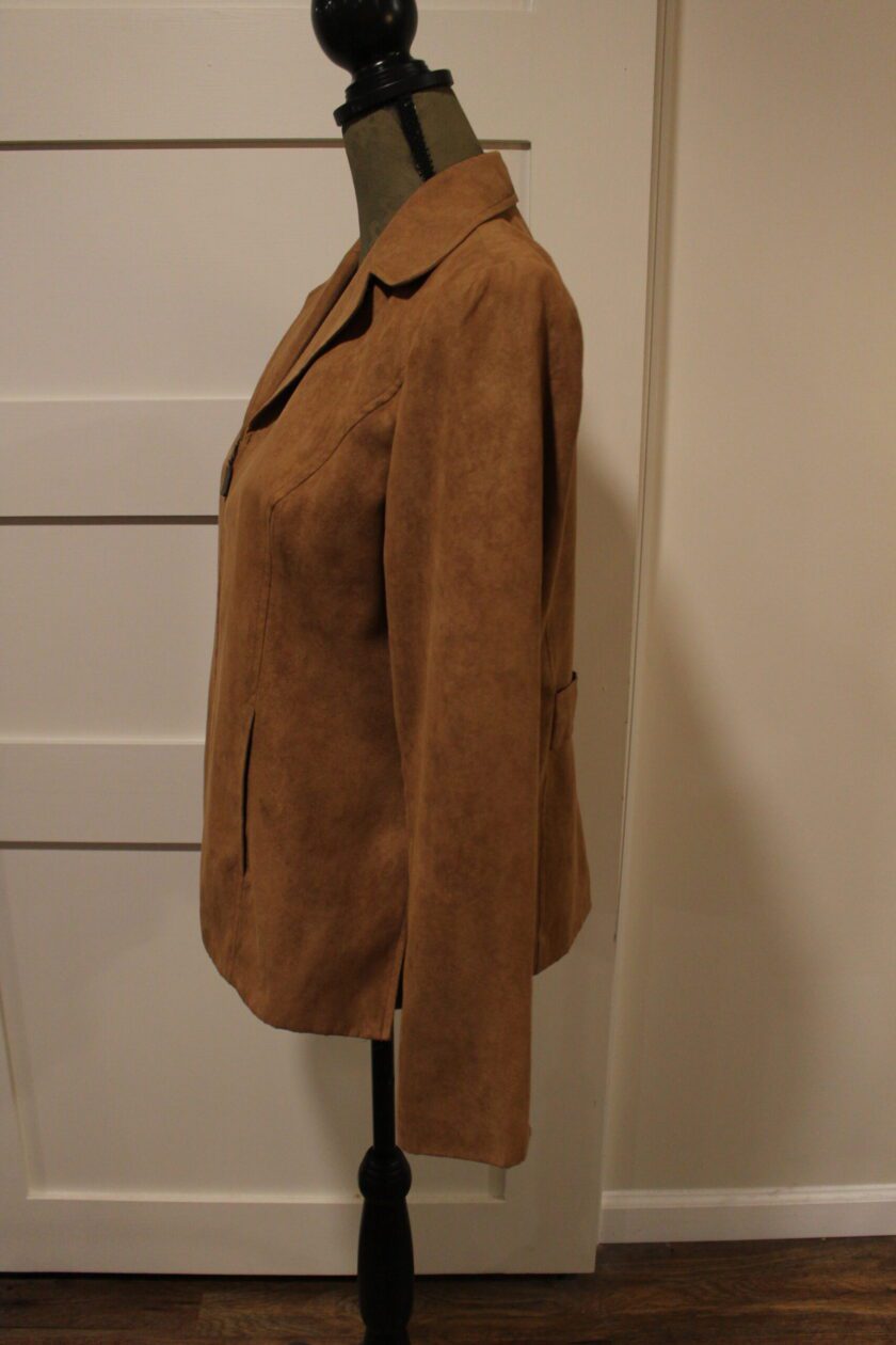 A brown jacket on a mannequin mannequin.