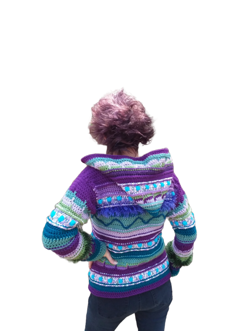 The back of a woman wearing a purple and blue sweater.
