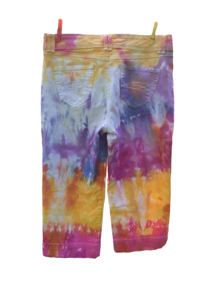 Tie dye capri jeans with bold splashes of yellow, orange, hot pink, raspberry and blue.