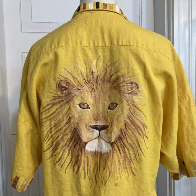 A yellow shirt with a lion on it.