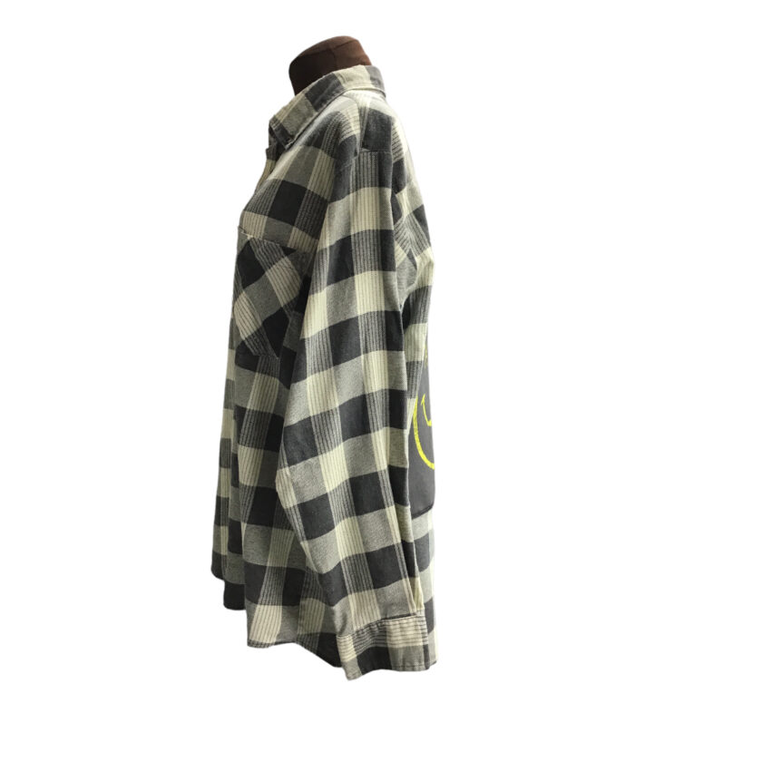 A black and white flannel shirt on a mannequin.