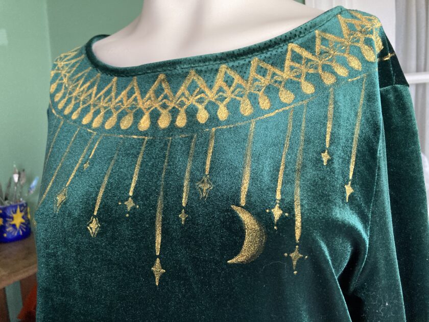 Top of green velvet dress with hand-painted gold collar details