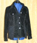 A black jacket on a mannequin mannequin.
