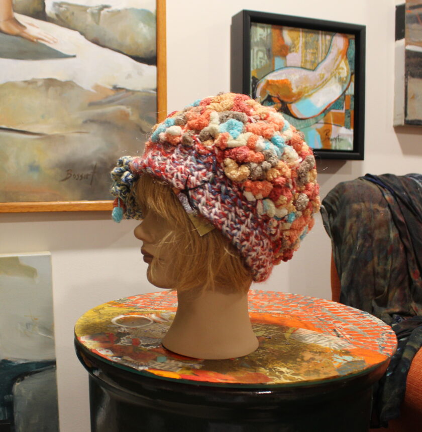 A mannequin wearing a hat.