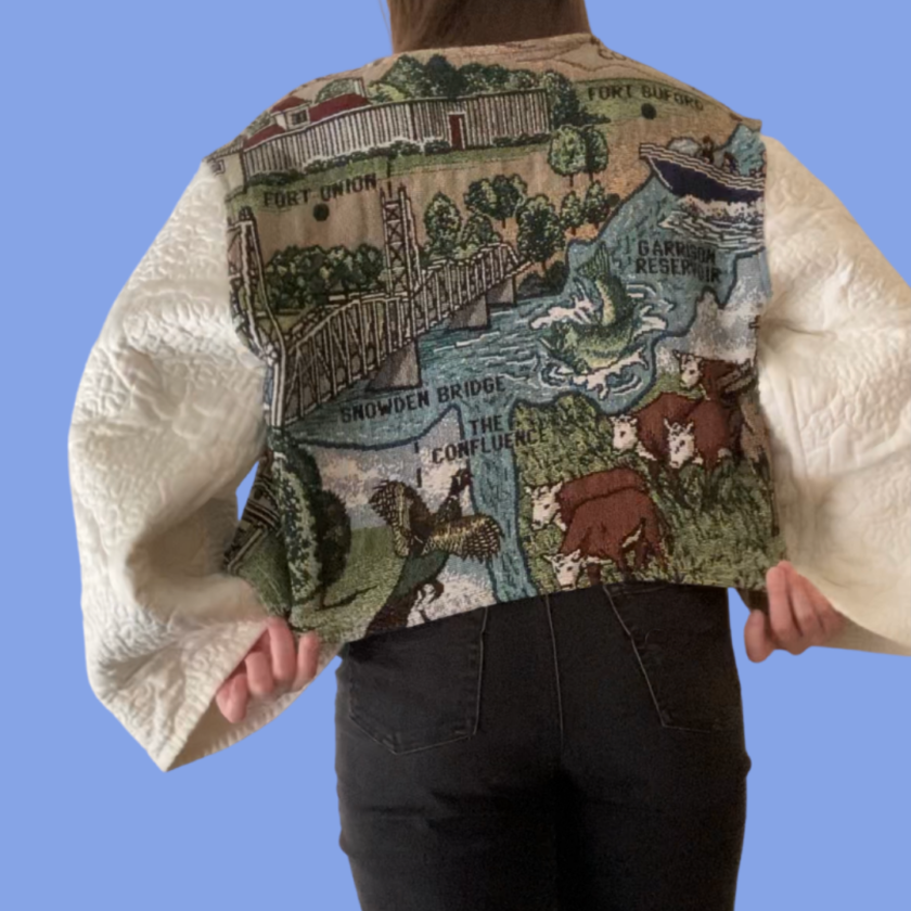 The back of a woman wearing a quilted jacket.