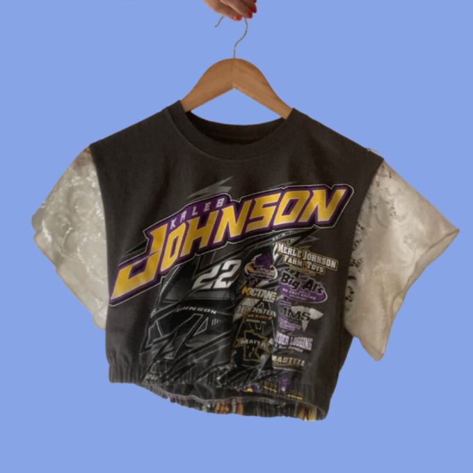 A cropped t - shirt with the word johnson on it.